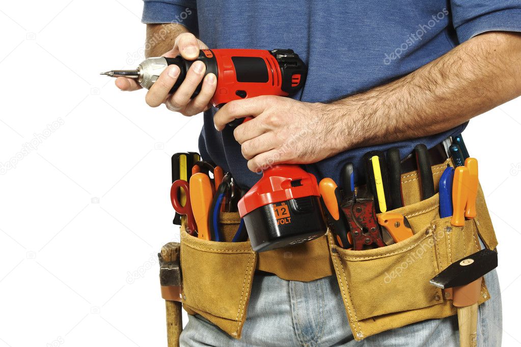 Handyman tightening a screw with tools